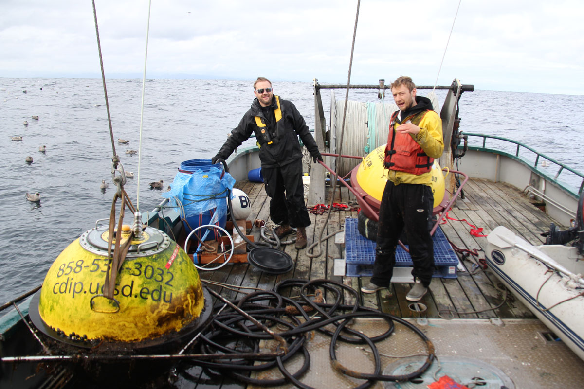 Andrew Gray and Marko Patticcui on board the F/V Anna D with CDIP buoys. Photo Credit: Dan Miller